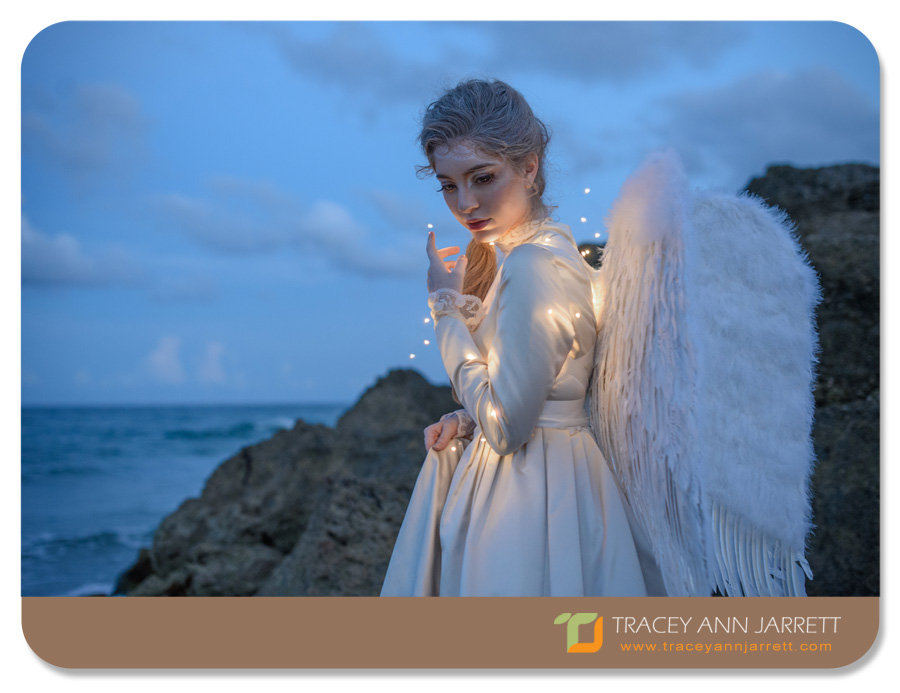 creative portrait photography of angel on the beach rescuing the moon